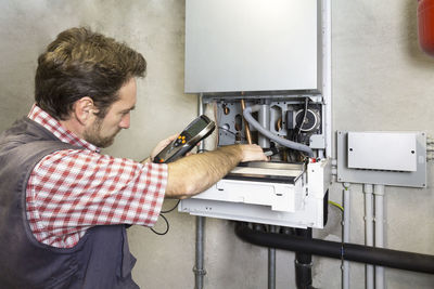 Side view of man working at home