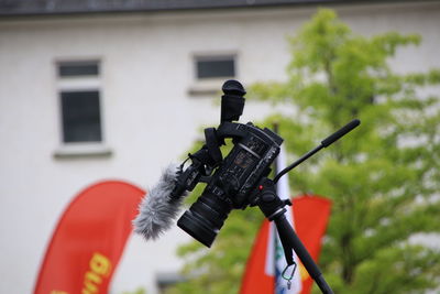 Close-up of camera on house against building