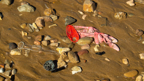 High angle view of pollution plastic rubbish on beach