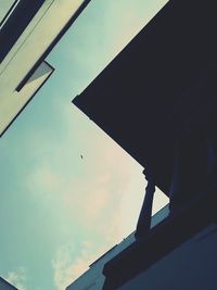 Low angle view of birds flying against sky