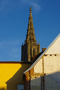 Low angle view of ulm cathedral against clear blue sky