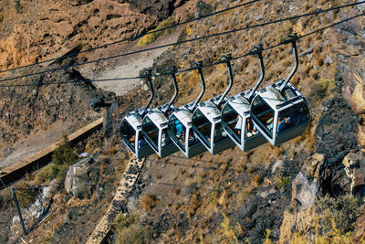 High angle view of umbrellas on rock against wall