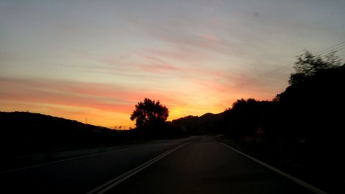 Road against sky during sunset