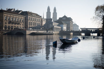 Boats moored in river