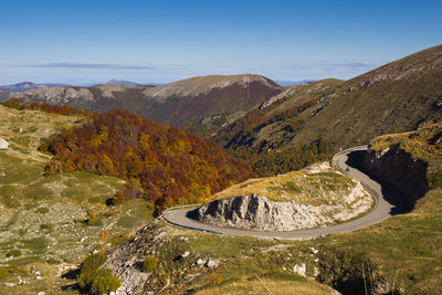 High angle view of road amidst mountains against sky