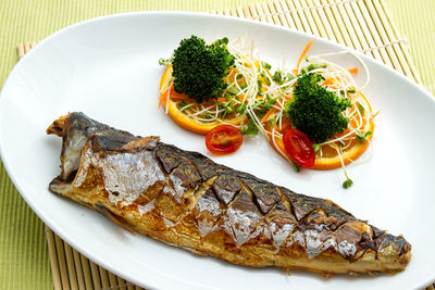 High angle view of fish served on table