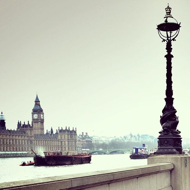 clear sky, architecture, built structure, building exterior, copy space, tower, transportation, international landmark, famous place, city, travel destinations, travel, water, nautical vessel, capital cities, tourism, tall - high, waterfront, mode of transport, river