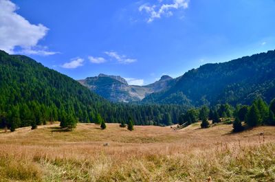 Scenic view of landscape and mountains against sky