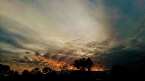 Low angle view of dramatic sky at sunset