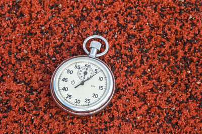 Close-up of stopwatch on field