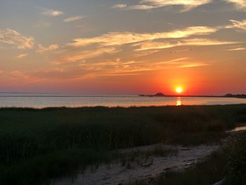 Scenic view of sea against sky during sunset