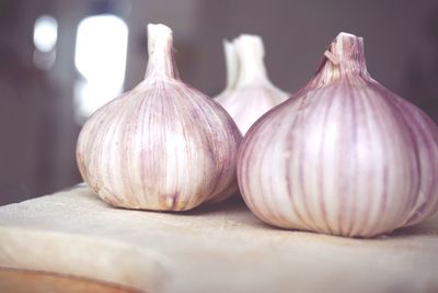 Close-up of garlic on cutting board