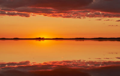 Scenic view of dramatic sky over calm lake