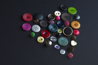 High angle view of various buttons on table