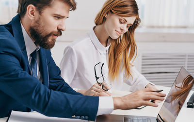 Business colleagues working in office