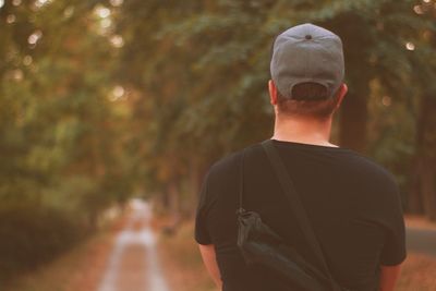 Rear view of man standing at park