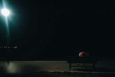 Blurred motion of illuminated people at night