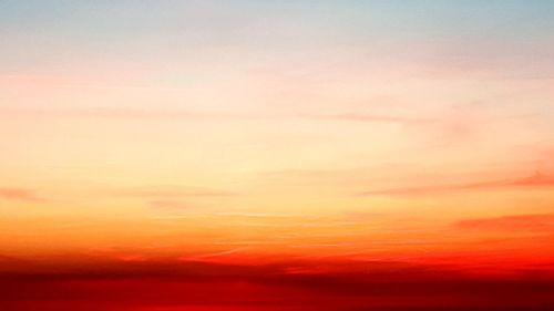 Low angle view of dramatic sky during sunset