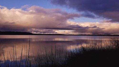 Scenic view of lake against sky during sunset