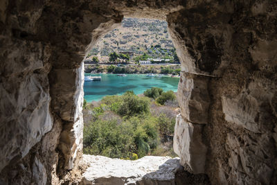 Scenic view of sea seen through cave