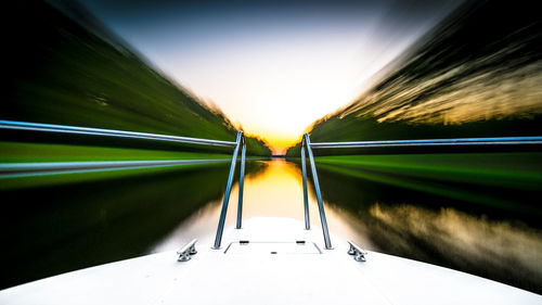 Blurred motion of car on road against sky