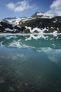 Scenic view of frozen lake against mountain