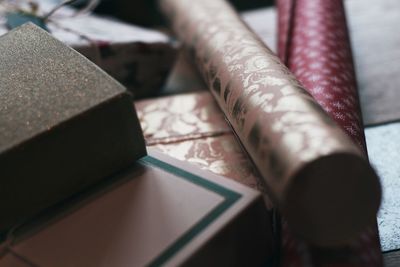 Close-up of gifts with wrapping papers on table