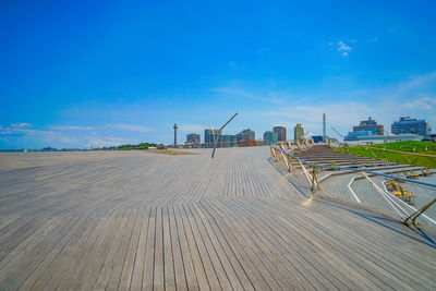 Scenic view of beach against blue sky