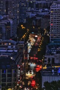 High angle view of illuminated buildings in city at night