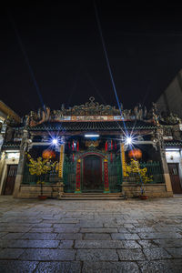 Illuminated city buildings at night