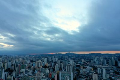 High angle view of buildings against sky during sunset