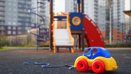 Close-up of toy on street in city