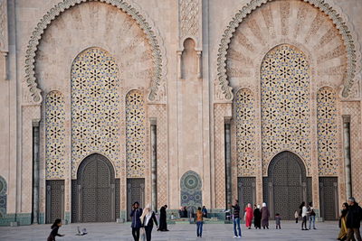 Group of people in front of historical building