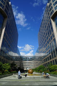 Low angle view of modern buildings against sky