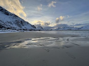 Scenic view of beach against sky during sunset