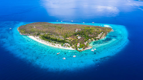 Aerial view of island amidst sea