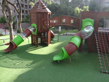 Chairs and plants in lawn outside building