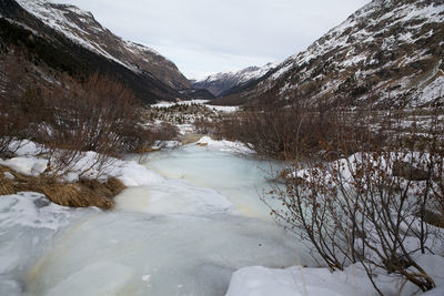 Scenic view of snow covered mountain against sky