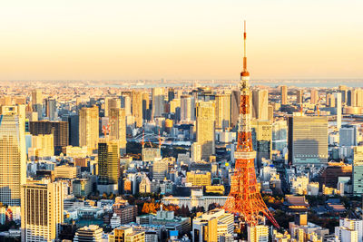 Aerial view of city buildings during sunset