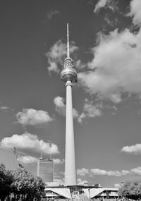 Low angle view of communications tower against sky