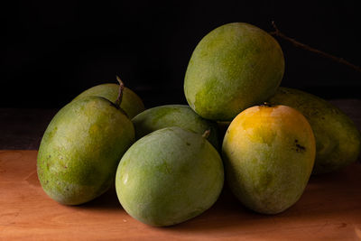 Close-up of mangos on table