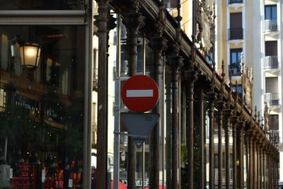 Building made of glass and a traffic sign in a city