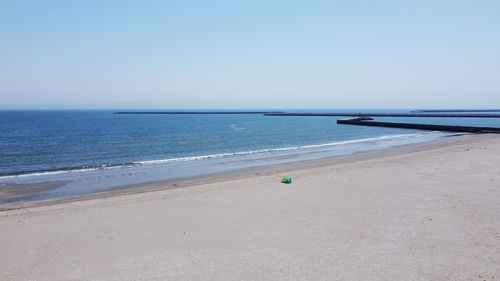 Scenic view of beach against clear sky