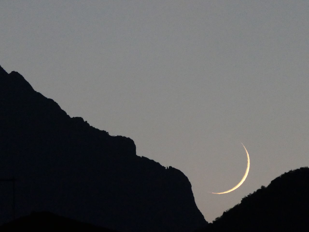 crescent, sky, silhouette, beauty in nature, moon, scenics - nature, nature, night, mountain, space, no people, tranquility, tranquil scene, astronomy, cloud, outdoors, eclipse, copy space, astronomical object, low angle view, environment