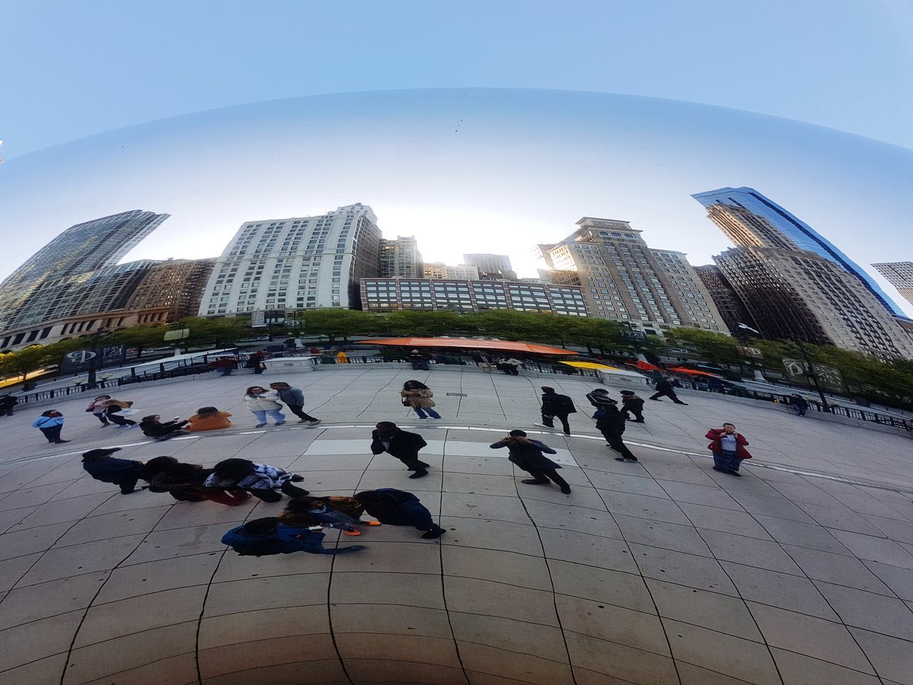 architecture, built structure, large group of people, real people, leisure activity, building exterior, lifestyles, city life, skyscraper, men, city, modern, travel destinations, day, indoors, women, fish-eye lens, ice rink, sky, people