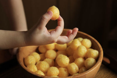 Close-up of hand holding fruits