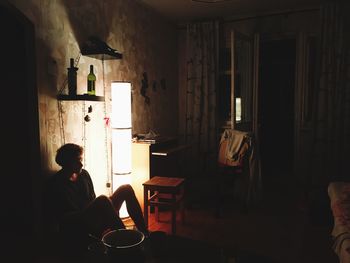 Man sitting in darkroom