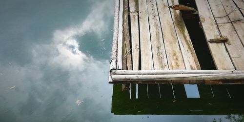 High angle view of abandoned house by lake