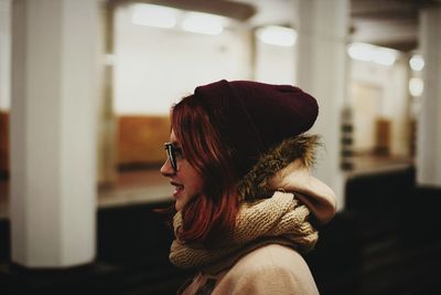 Close-up of young woman in warm clothing