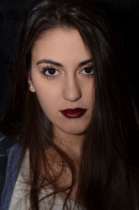 Close-up portrait of beautiful woman with brown lipstick